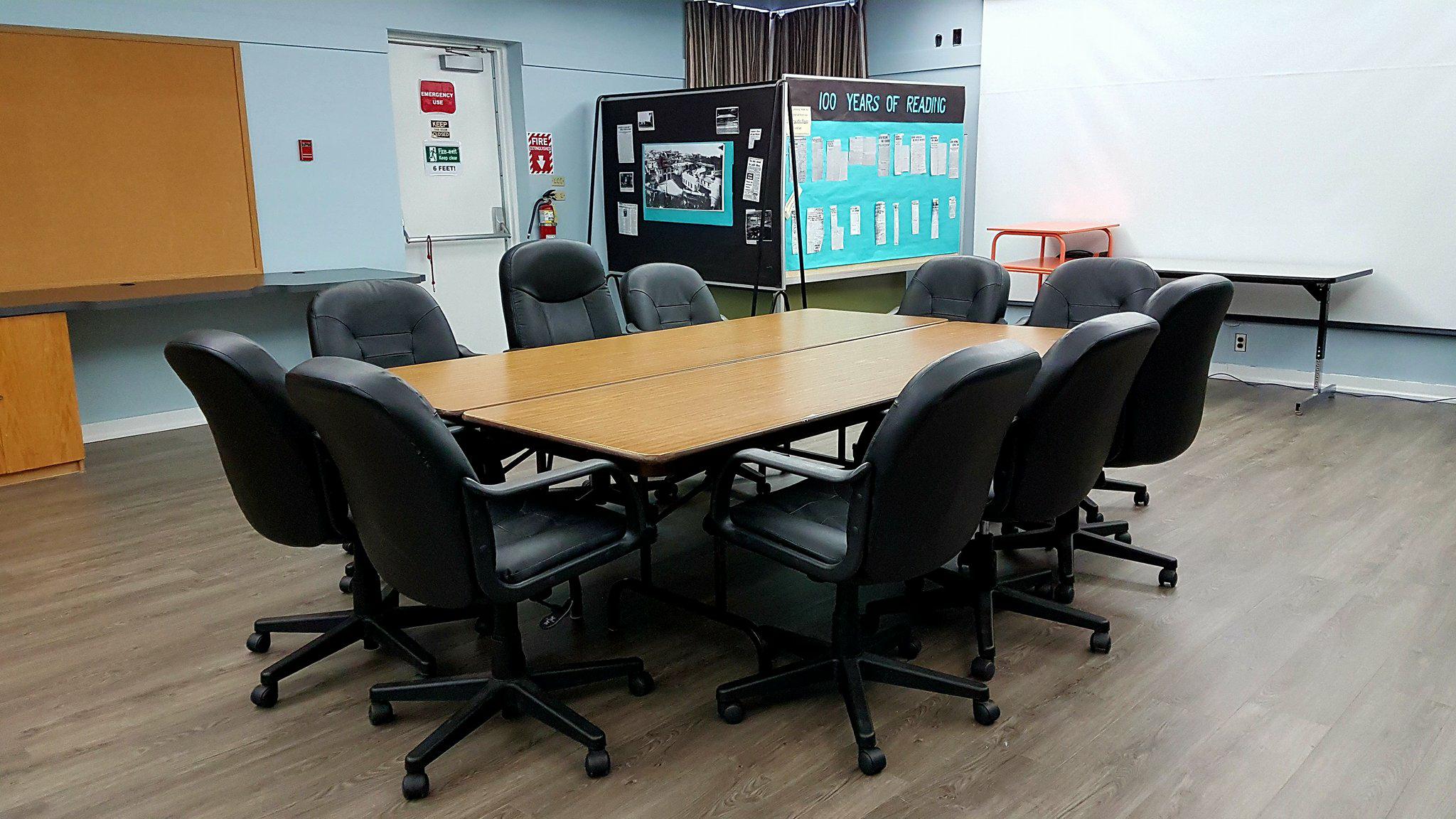 Prince Rupert Public Library Multi-Purpose Room — a bright meeting room with windows, tables, and chairs